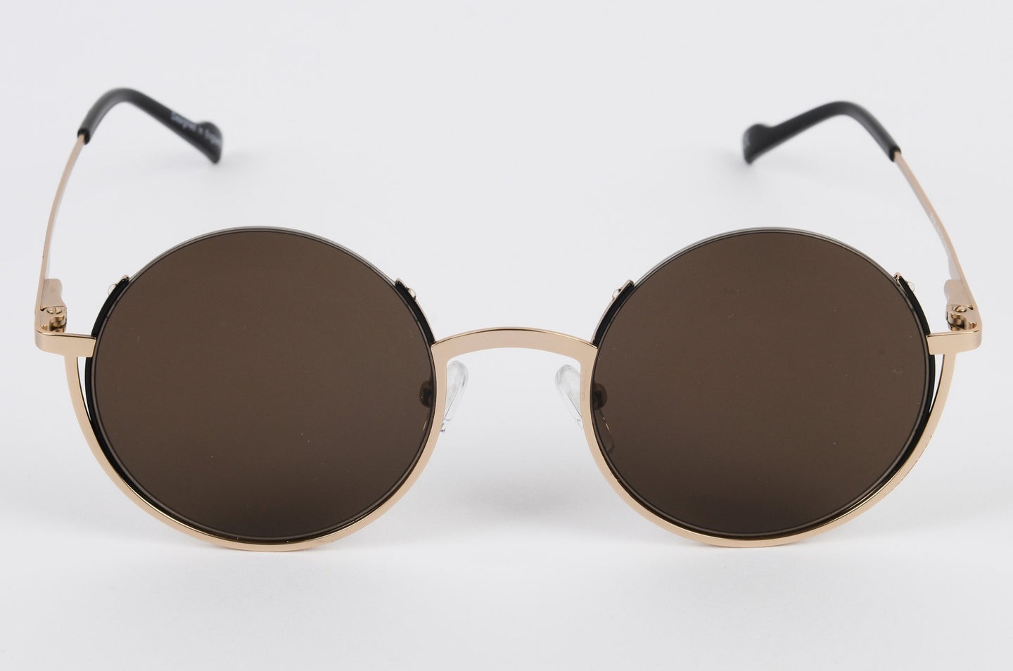 Round prescription sunglasses in gold colour with brown tint