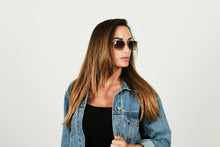 Load image into Gallery viewer, Woman in sunglasses wearing denim jacket

