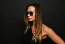 Load image into Gallery viewer, woman wearing sunglasses in black dress

