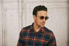 Load image into Gallery viewer, Man in checked shirt wearing sunglasses
